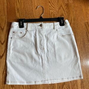 White denim mini skirt with detail stitching.